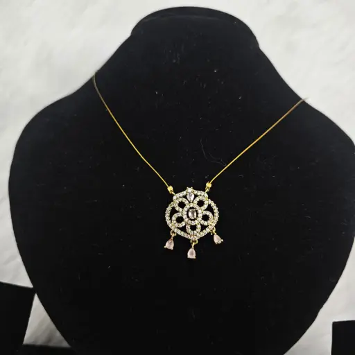 Gold Toned Pendant Necklace With a Floral Design White And Pink Gemstone