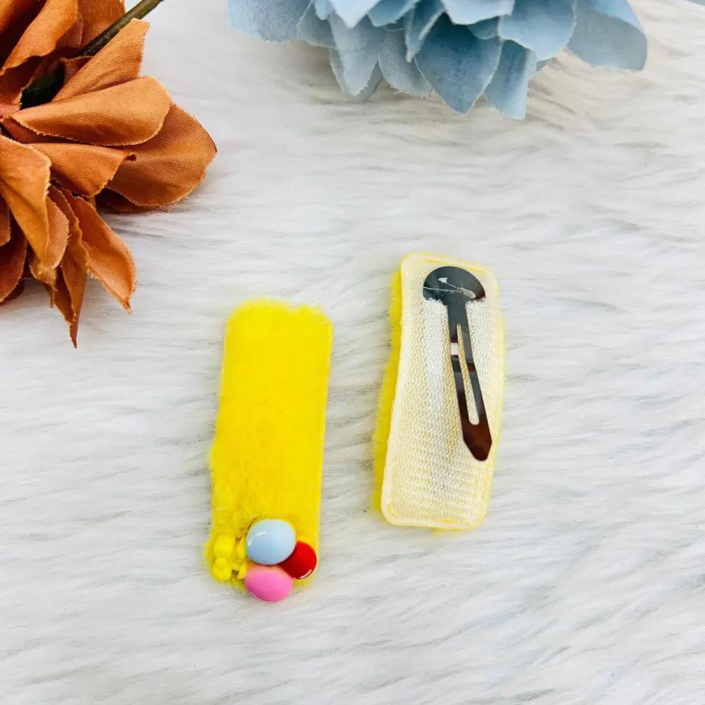 A Set Of Two Colorful Pom Pom Snap Hair Clips 6