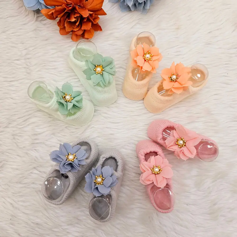 Baby Girl Socks Embellished With A Floral Design And A Pearl Accent