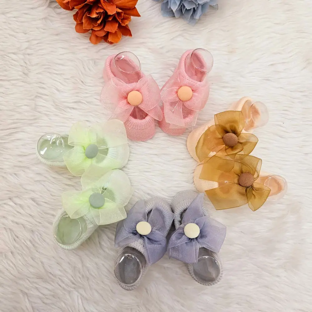Baby Socks Or Booties With A Decorative Bow And Button Detail (4)