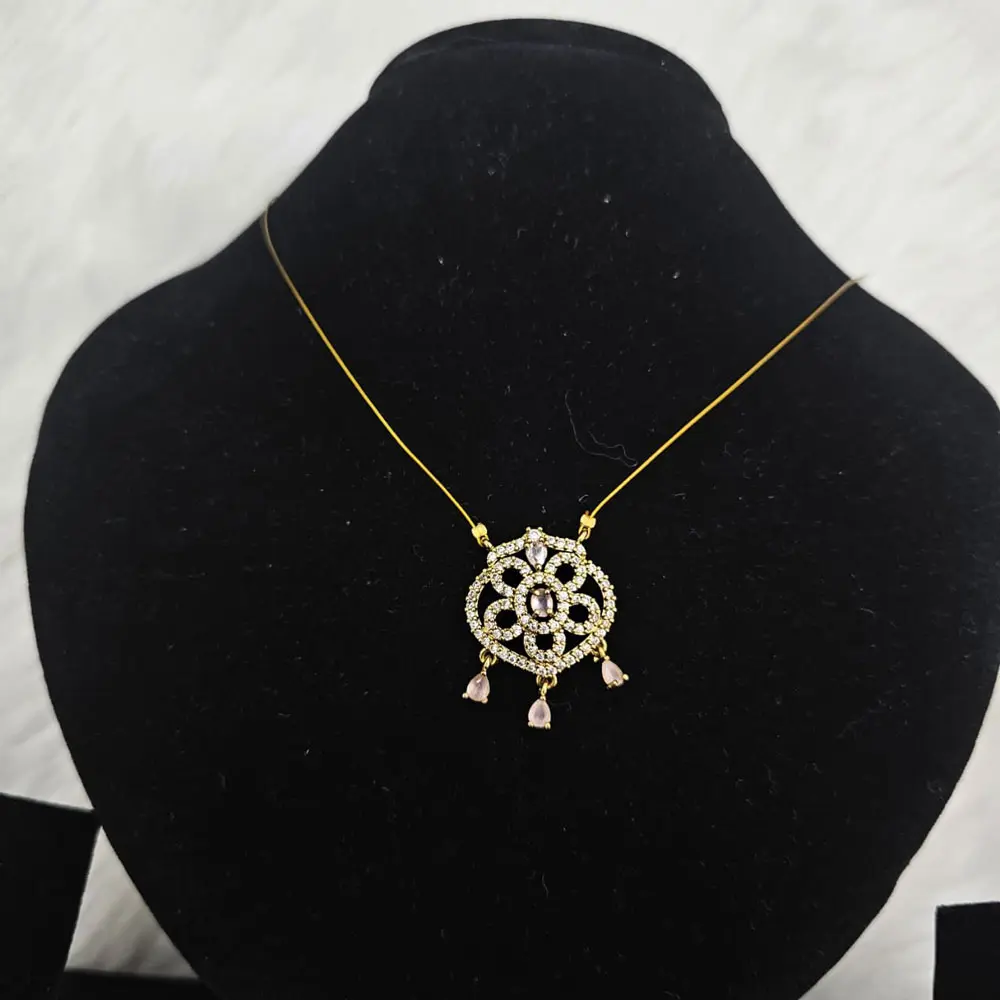 Gold Toned Pendant Necklace With a Floral Design White And Pink Gemstone