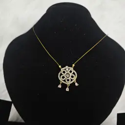 Gold Toned Pendant Necklace With a Floral Design White And Pink Gemstone